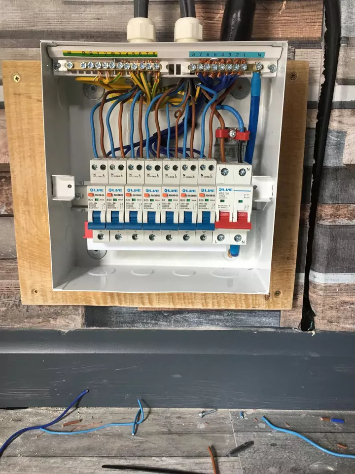 A new consumer unit mounted on a board with the new circuits connected
