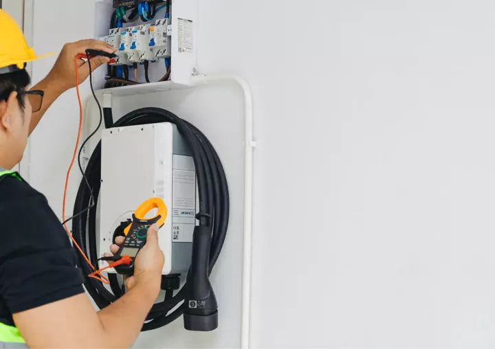 An electric vehicle wall charger being tested
